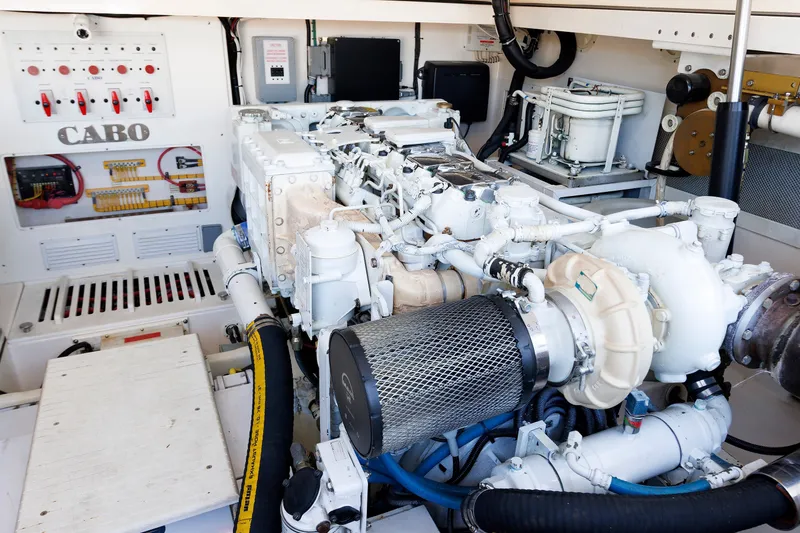 Slide: The Image of Engine room of a 2006 Cabo Yachts 40 Express, showcasing detailed mechanical components. - 46