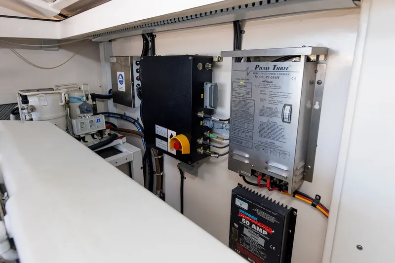 Slide: The Image of Engine room of 2006 Cabo Yachts 40 Express, featuring electrical components and systems. - 52