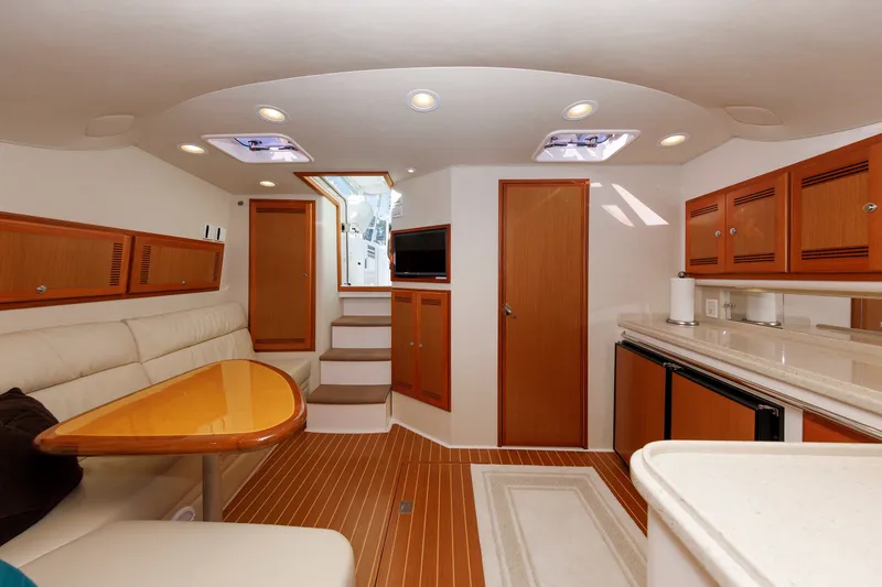 Slide: The Image of Luxurious interior of 2006 Cabo Yachts 40 Express with elegant wood finishes and modern amenities. - 24