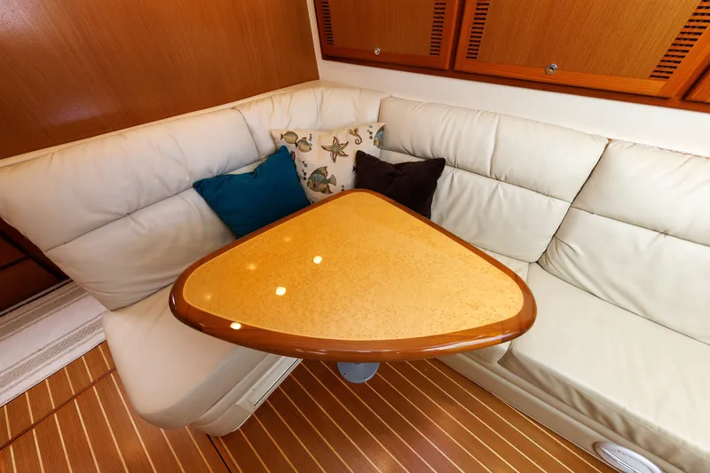 Slide: The Image of Luxurious interior of 2006 Cabo Yachts 40 Express with plush seating and elegant table. - 31