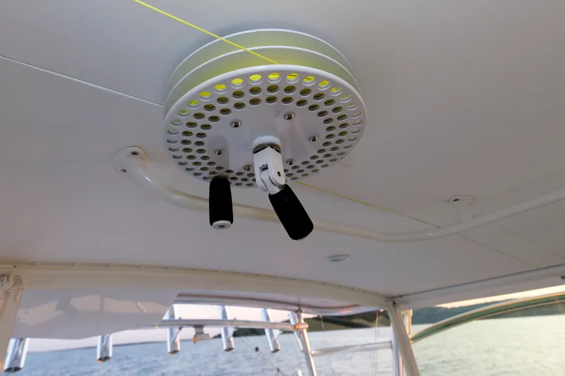 Slide: The Image of Ceiling-mounted fishing rod holder on a 2006 Cabo Yachts 40 Express boat. - 58