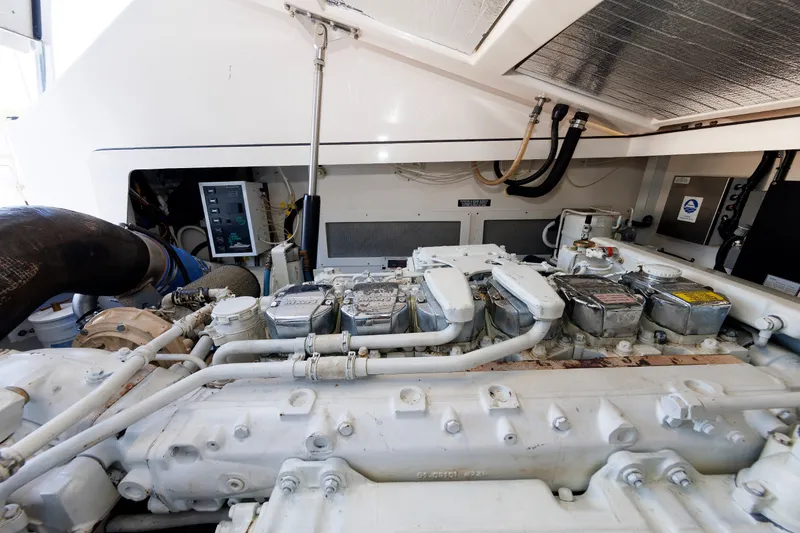 Slide: The Image of Engine room of a 2006 Cabo Yachts 40 Express, showcasing detailed machinery components. - 51