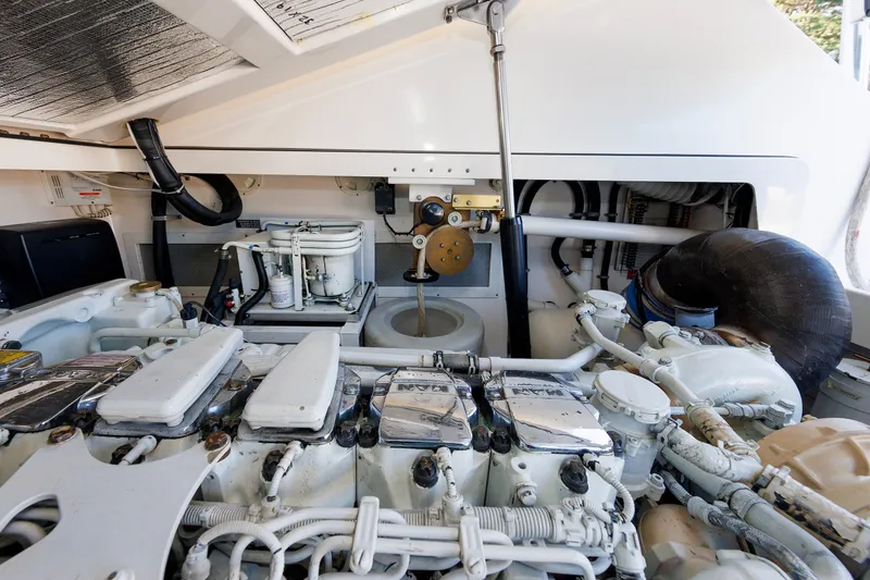 Slide: The Image of Engine room of a 2006 Cabo Yachts 40 Express, showcasing mechanical components and systems. - 50