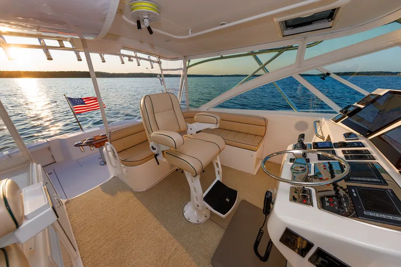 Slide: The Image of 2006 Cabo Yachts 40 Express helm with luxurious seating and panoramic ocean view. - 14