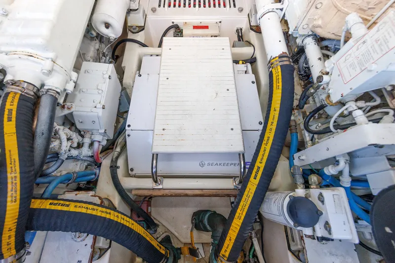 Slide: The Image of Engine room of 2006 Cabo Yachts 40 Express with Seakeeper stabilizer system. - 48