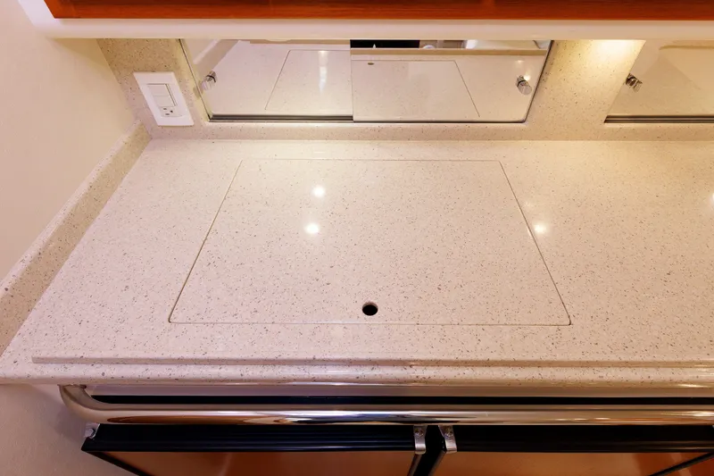 Slide: The Image of Luxurious countertop in 2006 Cabo Yachts 40 Express, featuring sleek design and integrated appliances. - 28