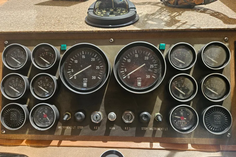 Slide: The Image of Control panel of a 1986 Jefferson 42 SE Sundeck Motor Yacht with gauges and switches. - 18