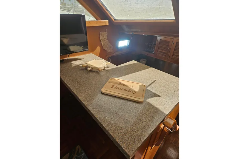 Slide: The Image of Interior of 1986 Jefferson 42 SE Sundeck Motor Yacht with countertop and decor. - 13