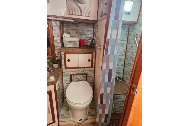 Slide: The Image of Bathroom interior of 1986 Jefferson 42 SE Sundeck Motor Yacht with shower and toilet. - 19