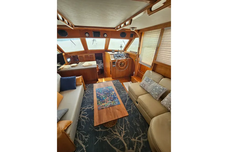 Slide: The Image of Interior of 1986 Jefferson 42 SE Sundeck Motor Yacht with cozy seating and nautical decor. - 27