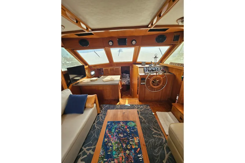 Slide: The Image of Interior of 1986 Jefferson 42 SE Sundeck Motor Yacht with helm, seating, and decor. - 29