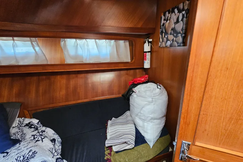 Slide: The Image of Cozy cabin interior of 1986 Jefferson 42 SE Sundeck Motor Yacht with wooden paneling. - 37