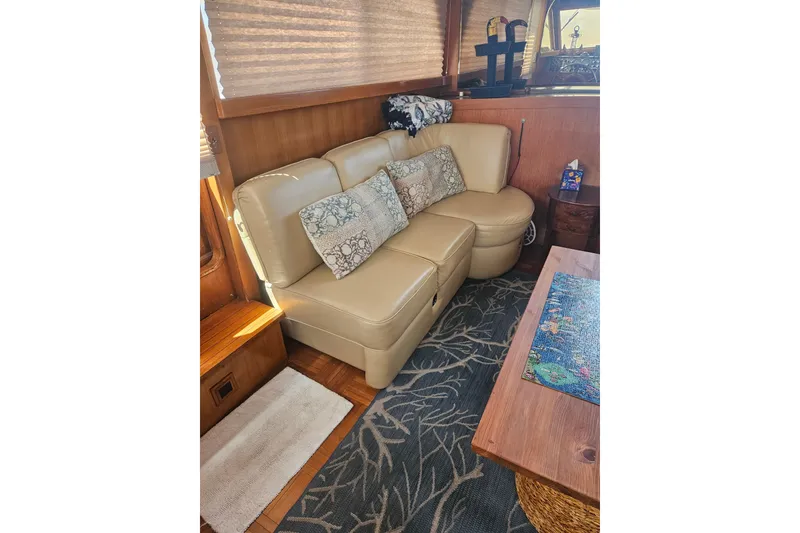 Slide: The Image of Interior of 1986 Jefferson 42 SE Sundeck Motor Yacht with beige leather seating. - 11