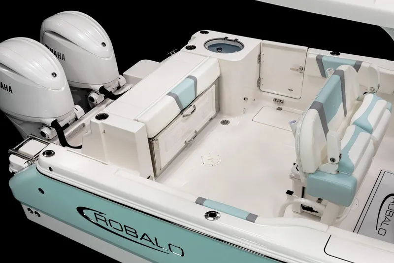 Slide: The Image of Manufacturer Provided Image: 2025 Robalo R250 Center Console boat interior with dual Yamaha engines, featuring seating and storage. - 8