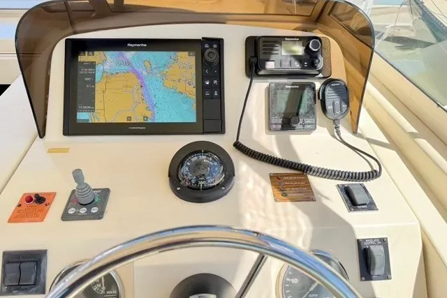 Slide: The Image of Helm of 2006 Mainship Pilot 34 Sedan with navigation equipment and controls. - 12