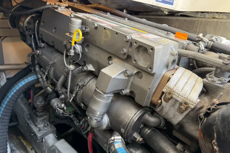 Slide: The Image of Engine of a 2006 Mainship Pilot 34 Sedan boat, showcasing mechanical components. - 23