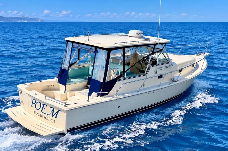 The Image of 2006 Mainship Pilot 34 Sedan cruising on open blue sea. - 0