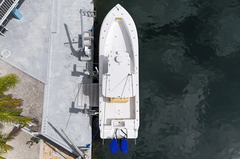 Slide: The Image of Overhead view of a 2006 SeaVee 340B boat docked by a concrete pier. - 17