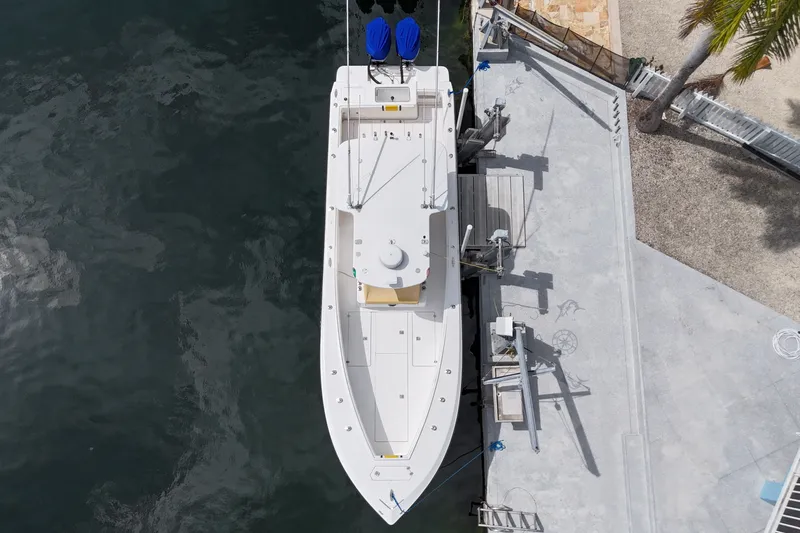 Slide: The Image of Overhead view of a 2006 SeaVee 340B boat docked by the water. - 16