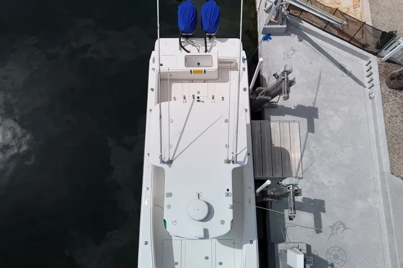Slide: The Image of Aerial view of a 2006 SeaVee 340B boat docked at a marina. - 14