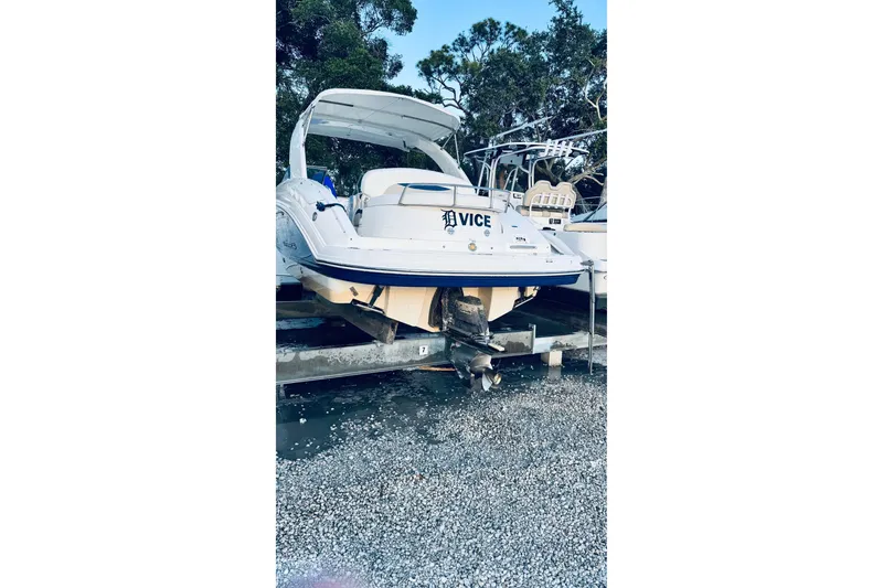 The Image of 2007 Chaparral 276 SSX boat on trailer, parked outdoors near trees. - 0