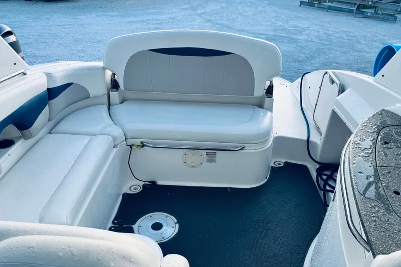 Slide: The Image of 2007 Chaparral 276 SSX boat interior with white seating and blue accents. - 13