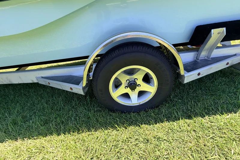 Slide: The Image of Trailer wheel of 2021 Chittum Skiffs Islamorada 21 on grass. - 13