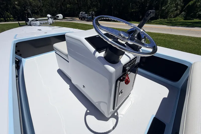 Slide: The Image of 2021 Chittum Skiffs Islamorada 21 boat console with steering wheel and seating. - 42