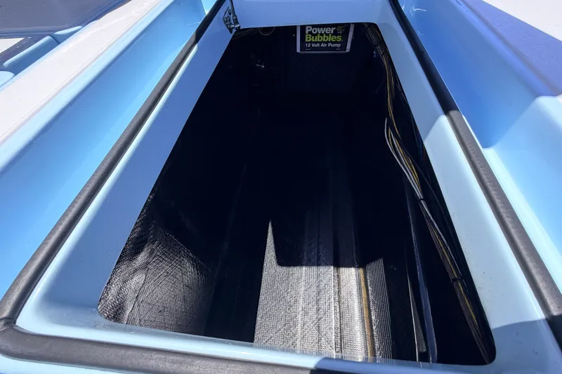 Slide: The Image of 2021 Chittum Skiffs Islamorada 21 storage compartment with Power Bubbles air pump. - 65
