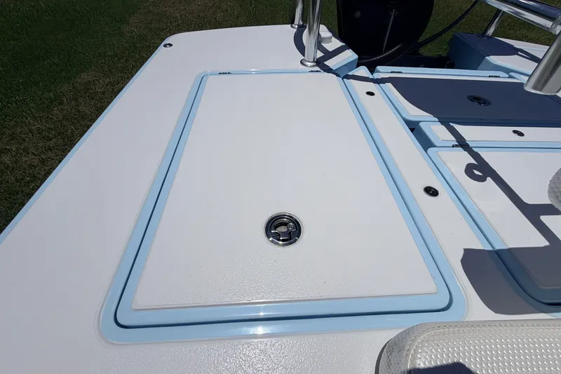 Slide: The Image of 2021 Chittum Skiffs Islamorada 21 deck with storage hatch and sleek design. - 58
