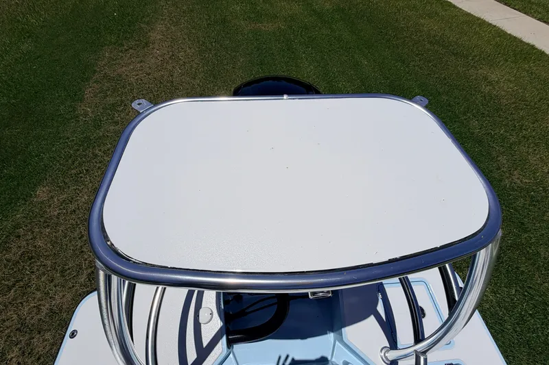 Slide: The Image of 2021 Chittum Skiffs Islamorada 21 boat with a white platform on grass. - 82