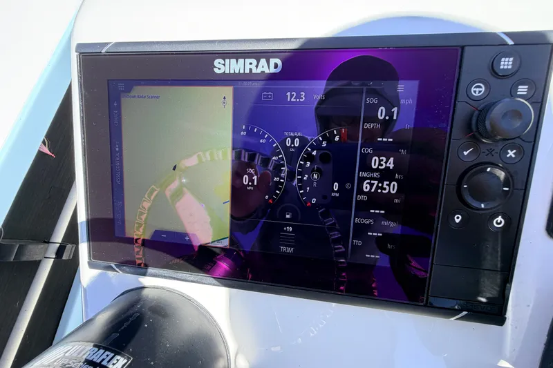 Slide: The Image of Simrad display on 2021 Chittum Skiffs Islamorada 21, showing navigation and engine data. - 43