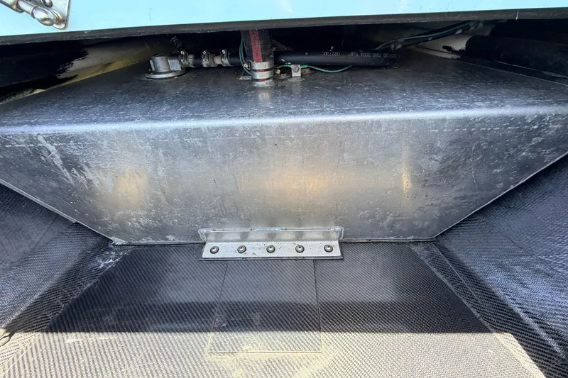 Slide: The Image of 2021 Chittum Skiffs Islamorada 21 boat interior, showcasing metal compartment and wiring. - 31