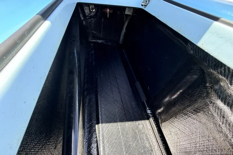 Slide: The Image of Interior view of 2021 Chittum Skiffs Islamorada 21, showcasing storage compartment details. - 61