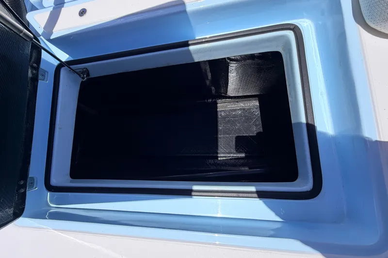 Slide: The Image of Open storage compartment on a 2021 Chittum Skiffs Islamorada 21 boat. - 60