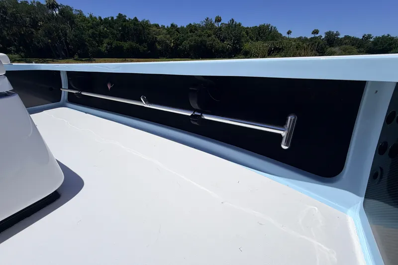 Slide: The Image of 2021 Chittum Skiffs Islamorada 21 interior detail with rod holder, sunny day. - 35