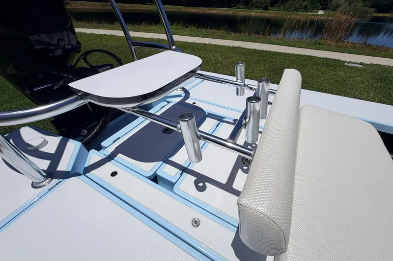 Slide: The Image of 2021 Chittum Skiffs Islamorada 21 boat interior with seating and rod holders. - 57