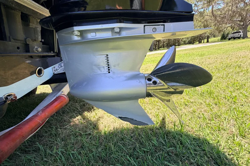 Slide: The Image of Propeller of 2021 Chittum Skiffs Islamorada 21 on grassy terrain. - 16