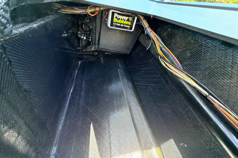 Slide: The Image of Interior view of 2021 Chittum Skiffs Islamorada 21 with wiring and air pump. - 66