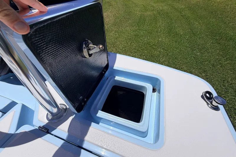 Slide: The Image of Open storage compartment on 2021 Chittum Skiffs Islamorada 21 boat, showing interior details. - 68