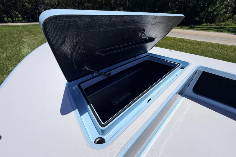 Slide: The Image of Open storage compartment on 2021 Chittum Skiffs Islamorada 21 boat, showcasing interior space. - 29