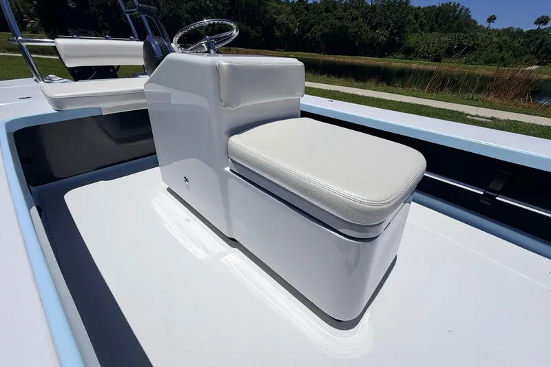Slide: The Image of 2021 Chittum Skiffs Islamorada 21 boat interior with white seating and steering console. - 38