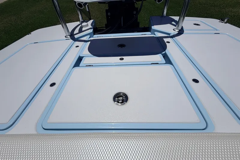 Slide: The Image of 2021 Chittum Skiffs Islamorada 21 deck with storage compartments and sleek design. - 70