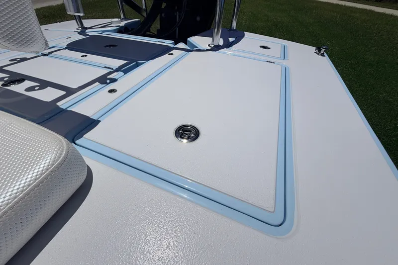 Slide: The Image of 2021 Chittum Skiffs Islamorada 21 deck with sleek design and storage compartments. - 63