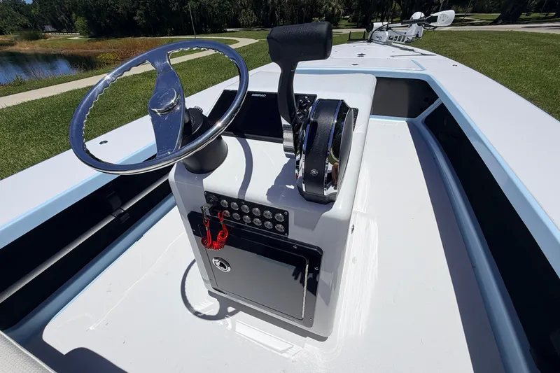Slide: The Image of 2021 Chittum Skiffs Islamorada 21 boat console with steering wheel and controls. - 41