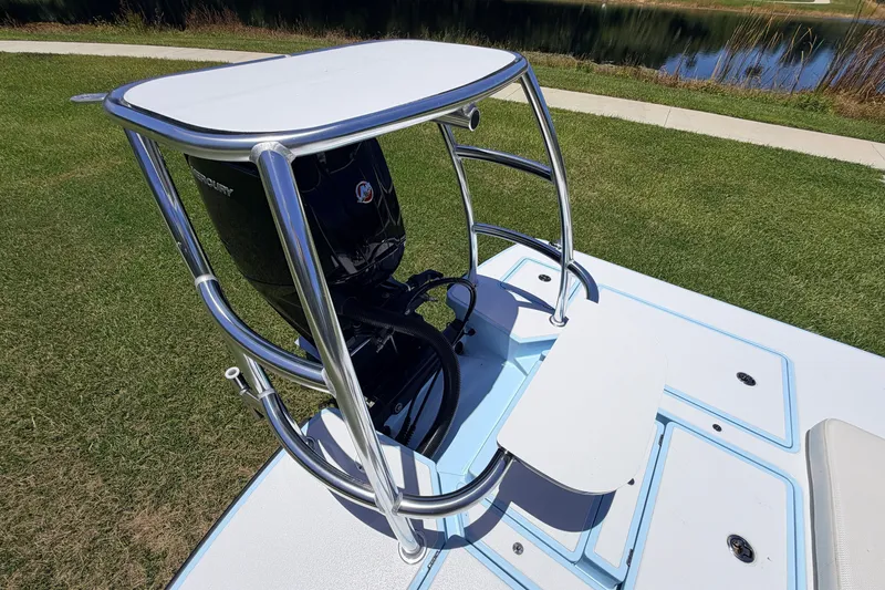 Slide: The Image of 2021 Chittum Skiffs Islamorada 21 boat with Mercury engine on grassy area. - 81
