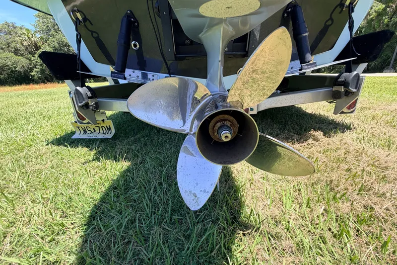 Slide: The Image of Propeller of 2021 Chittum Skiffs Islamorada 21 boat on grass. - 17