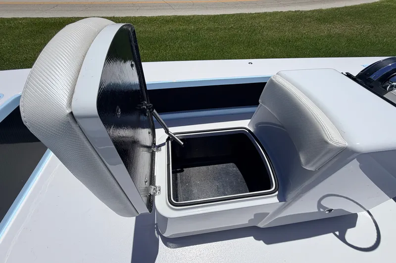 Slide: The Image of 2021 Chittum Skiffs Islamorada 21 boat seat with open storage compartment. - 40