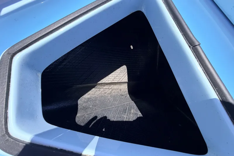 Slide: The Image of Chittum Skiffs Islamorada 21, 2021 model, blue storage compartment detail. - 27