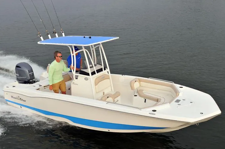 Slide: The Image of Manufacturer Provided Image: 2017 NauticStar 231 Coastal boat cruising on water. - 8